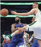  ?? GETTY IMAGES ?? Pistons center Andre Drummond (left) collides with Bucks center Brook Lopez as they go for a rebound in Game 3 on Saturday.