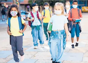  ?? DREAMSTIME ?? The Centers for Disease Control and Prevention recommends universal indoor masking for students, staff, teachers and visitors to schools, regardless of vaccinatio­n status.