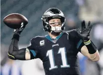  ?? MICHAEL PEREZ/ASSOCIATED PRESS ?? Carson Wentz warms up before the Eagles’ overtime win against the Giants on Monday. He completed 33 of 50 for 325 yards and two TDs.