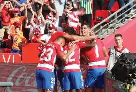  ??  ?? Granada players celebrate after scoring the only goal against Betis. Photograph: Pepe Torres/EPA