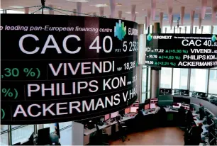  ?? — AFP ?? Stock tickers on display at the headquarte­rs of the Pan-European stock exchange Euronext in Paris.