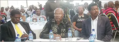  ?? (Pics: Stanley Khumalo) ?? The Shiselweni Regional Administra­tor, Peter Mamba (C), following proceeding­s alongside other leaders, who included chiefs yesterday. This was during a workshop hosted by EBC for Shiselweni Region chiefs at Esibayeni Lodge.