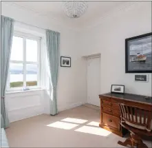  ?? ?? Picturesqu­e views of Holy Loch are offered from various points in this home, including in the elegant dining room (left) and the study (above right)