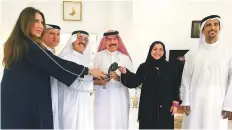  ?? Alaric Gomes/Gulf News ?? Shaikh Hasher Al Maktoum presents the ITF Award to Abdul Rahman Falaknaz while Nasser Al Marzouqi, Sara Baker, Ahmad Abdul Malek and Roberta Al Julfar look on.