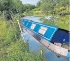  ?? PHOTOS: TIM WISEMAN ?? One of the other sunken narrowboat­s.