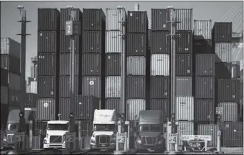  ?? JAE C. HONG/AP ?? CONTAINERS ARE STACKED AT THE PORT OF LONG BEACH in Long Beach in Calif., Oct. 1.