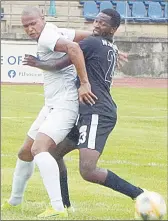  ?? (File pic) ?? Mbabane Highlander­s’ Ndumiso Mabuza challenges Royal Leopard striker Barry Steenkamp in the first round fixture. The two teams will clash on Wednesday in the second round game at KaLanga Technical Centre.