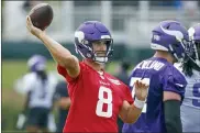  ?? BRUCE KLUCKHOHN — THE ASSOCIATED PRESS ?? Minnesota Vikings quarterbac­k Kirk Cousins throws during training camp Wednesday, July 28, 2021, in Eagan, Minn. He returned to camp after going through a quarantine.