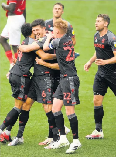  ??  ?? HERO OF THE HOUR: Danny Batth receives the congratula­tions after his equalising goal. Pic: Getty Images