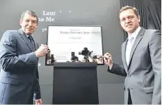  ??  ?? Head of Region Overseas Mercedes Benz Dr Till Conrad (left) with President and Claus signing the plague to mark the official launching of Wisma Mercedes Benz and the Mercedes Benz Malaysia Training Academy at Bandar Kinrara yesterday. — Bernama photo