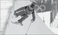  ?? AP PHOTO/KIN CHEUNG ?? Elizabeth Marian Swaney, of Hungary, runs the course during the women’s halfpipe qualifying at Phoenix Snow Park at the 2018 Winter Olympics in Pyeongchan­g, South Korea, Monday.