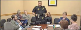  ?? / Sean Williams ?? Aragon Police Chief Paul Mazzuca showed off the style of vest he’d like for his officers to decrease the amount of weight they are carrying while on duty.