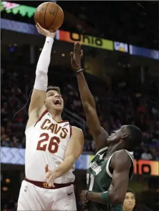  ?? TONY DEJAK — THE ASSOCIATED PRESS ?? The Cavaliers’ Kyle Korver shoots over the Bucks’ Tony Snell in the first half at Quicken Loans Arena on Nov. 7.