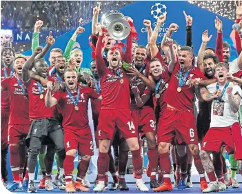  ??  ?? Liverpool celebrate their Champions League win in Madrid last May