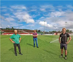  ?? Pic: Mandy Jones ?? Miles Todd of 360 Ground Care, club chairman Shon Powell and secretary Stephen Whitfield on Denbigh Town’s new £200,000 pitch