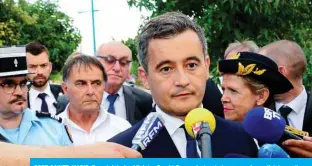  ??  ?? PORT-SAINTE-MARIE: French Interior Minister Gerald Darmanin (center) answers journalist­s’ questions as he visits the Gendarmeri­e of Port-Sainte-Marie near Agen to pay tribute in Gendarme Melanie Lemee who was fatally hit by a car at a military checkpoint on the D813 road. — AFP