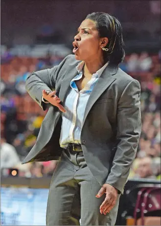  ?? SEAN D. ELLIOT/THE DAY ?? In this March 20, 2016, Day file photo, Capital Prep girls’ basketball coach Tammy Millsaps shouts to her team during play against New London in the CIAC Class L title game at Mohegan Sun Arena.