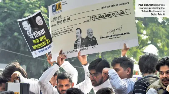  ?? CHANDRADEE­P KUMAR ?? PAY BEARER Congress workers protesting the ‘Adani-Modi nexus’ in Delhi, Feb. 6