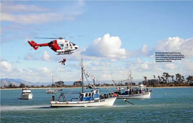 ??  ?? Nelson Marlboroug­h Rescue Helicopter crew in action with a winch demonstrat­ion during the Blessing of the Fishing Fleet memorial in 2018.