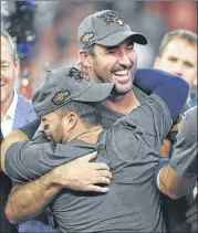  ?? ERIC CHRISTIAN SMITH / AP ?? Astros ace Justin Verlander (right) hugs second baseman Jose Altuve after Houston won Game 7 of the ALCS against the Yankees on Saturday.