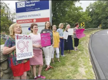  ?? ASSOCIATED PRESS ?? Residents from various communitie­s in mostly rural northeaste­rn Connecticu­t stage a protest, Monday, outside Day Kimball Hospital in Putnam, Conn. The protesters are concerned with Day Kimball Healthcare’s plans to affiliate with Covenant Healthcare, a Catholic health system that abides by directives set by the US Conference of Catholic Bishops.