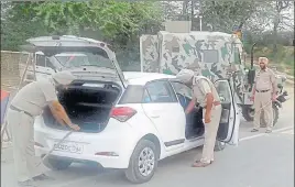  ?? HT PHOTO ?? Police personnel checking a vehicle ahead of the Independen­ce Day near AttariBord­er in Amritsar on Saturday.