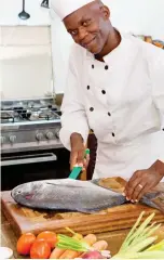  ??  ?? cut above: A chef prepares a fish at the Four Twenty South cottages