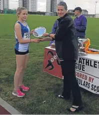  ??  ?? Hawkhill’s Megan Gowans receives her Best Performing Female Track prize.
