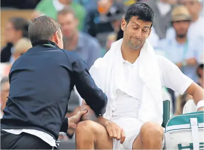  ?? Picture: Getty. ?? Novak Djokovic receiving treatment for the injury which forced him to retire from his quarter-final against Tomas Berdych at Wimbledon. He is now set to miss the US Open.