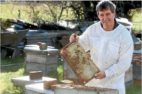  ?? PHOTO: SCOTT HAMMOND/STUFF ?? Murray Bush says beekeepers are cramming too many hives into one area, causing disease to run rampant and bees to starve.