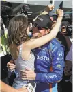  ?? Michael Conroy / Associated Press ?? Pole winner Scott Dixon celebrates with wife, Emma.