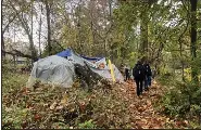  ?? RACHEL RAVINA - MEDIANEWS GROUP ?? Representa­tives of the Street Medicine team walk toward a tent during their first outing on Nov. 1in Norristown
