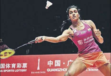  ?? AFP ?? PV Sindhu beat Japan's Nozomi Okuhara 21-19, 21-17 in one hour and two minutes in Guangzhou to lift the World Tour Finals.