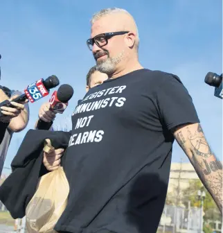  ?? SAM THOMAS/ORLANDO SENTINEL ?? Proud Boys organizer Joseph Randall Biggs, 37, walks from the George C. Young Federal Annex Courthouse on Wednesday after a hearing about storming the U.S. Capitol on Jan. 6.