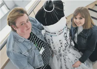  ??  ?? Sunderland College fashion students Jack Shirt and Sarah Fuller, with their Eyedoo dress.