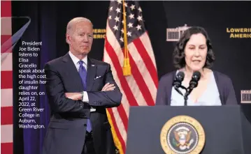  ?? KAREN DUCEY TNS file ?? President Joe Biden listens to Elisa
Gracello speak about the high cost of insulin her daughter relies on, on April 22, 2022, at Green River College in Auburn, Washington.