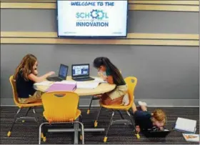  ?? NEWS-HERALD FILE ?? Third-grade students, from left, Iliana Ljubac-Kolar, Camille Ochoa and Delaney Zuren work on a science assignment at the School of Innovation in September 2015.