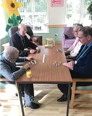  ??  ?? Sarah Mitchell, left, has worked at Dove House Hospice, below, for more than a year. Above, patients enjoy a game of dominoes