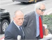  ?? AP ?? Lin Wood, right, attorney for plaintiff, British cave expert Vernon Unsworth, left, arrives at court.