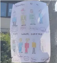  ??  ?? ●● Larissa Wilson, nine, has made a sign and posted it on a tree outside her house thanking all the key workers.