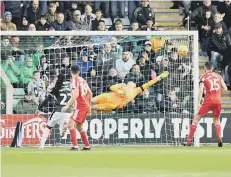  ??  ?? Jon McLaughlin pulls off an outstandin­g save.