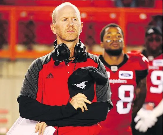  ?? JIM WELLS ?? Stampeders head coach Dave Dickenson believes it is crucial for players to practice in pads, especially quarterbac­ks, who need to adjust to the equipment while throwing.