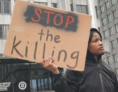  ?? SCOTT OLSON/GETTY IMAGES ?? Demonstrat­ors march through downtown Memphis protesting the death of Tyre Nichols on Saturday.