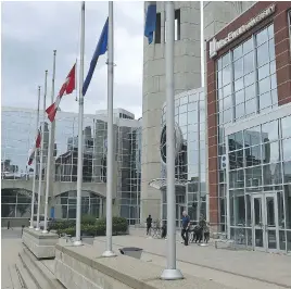  ?? ED KAISER ?? Flags fly at half-mast at Edmonton’s MacEwan University after student Misha Bazelevsky­y was identified as a victim of the terror attack in Nice, France.