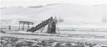  ??  ?? The old goldmining dredge, photograph­ed in 1957, after the town had been flooded.