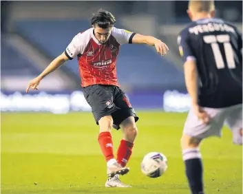  ??  ?? Finn Azaz fires in Cheltenham’s consolatio­n goal on Tuesday night