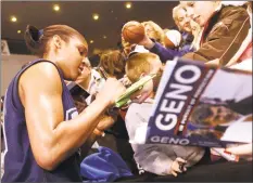  ?? Hearst Connecticu­t Media file photo ?? UConn forward Maya Moore signs autographs following practice at Bridgeport Arena at Harbor Yard in 2008.