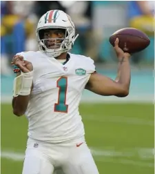  ?? Ap file ?? MAKING MOVES: Dolphins quarterbac­k Tua Tagovailoa has a new cast of weapons to throw to this season.