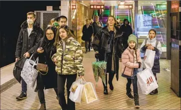  ?? Jonas Gratzer Getty I mages ?? PASSENGERS wait for a train in Stockholm last week. Sweden’s pandemic guidelines are voluntary and do not include mask wearing. Authoritie­s are tightening preventive measures as the situation has deteriorat­ed.