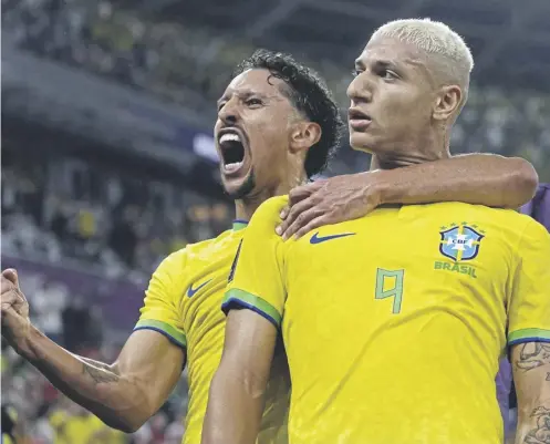  ?? ?? ↑ Brazil’s Richarliso­n, right, celebrates with team mate Marquinhos after scoring his side’s brilliant third goal against South Korea last